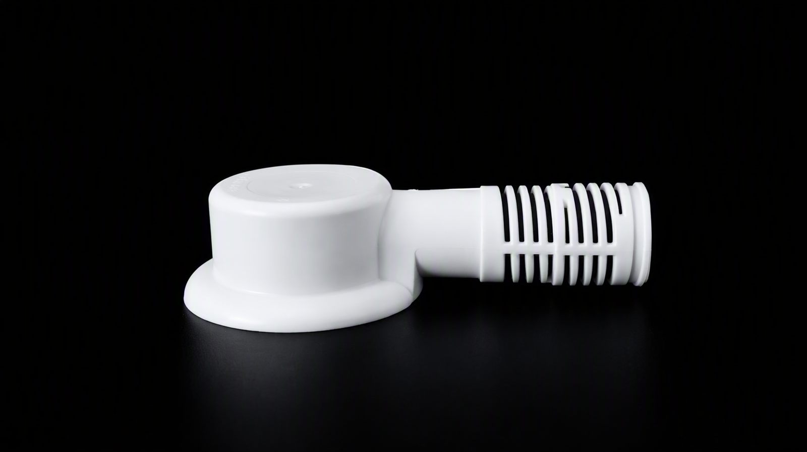 White plastic plumbing fitting